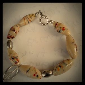 Glass beaded charm bracelet with stainless steel